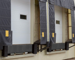 Bumpers on the exterior wall of a loading dock.